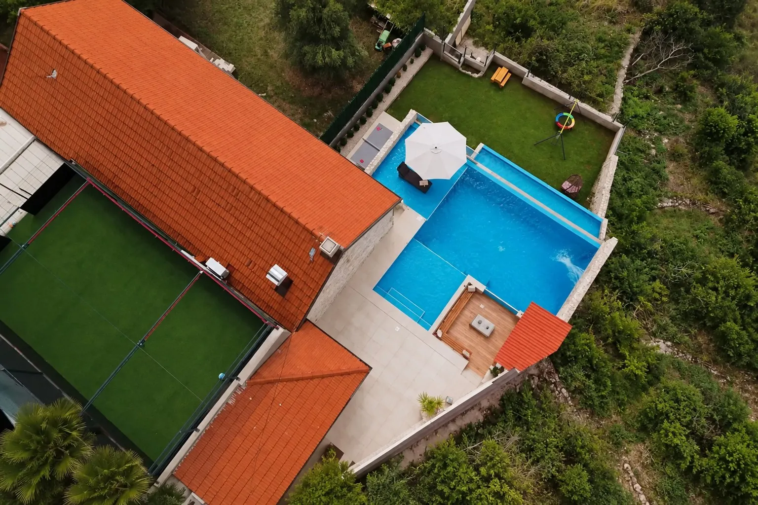 Aerial view of Sunset Stone Villa surrounded by greenery